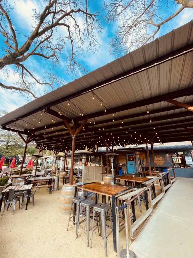 outdoor tables at an eatery on a sunny day
