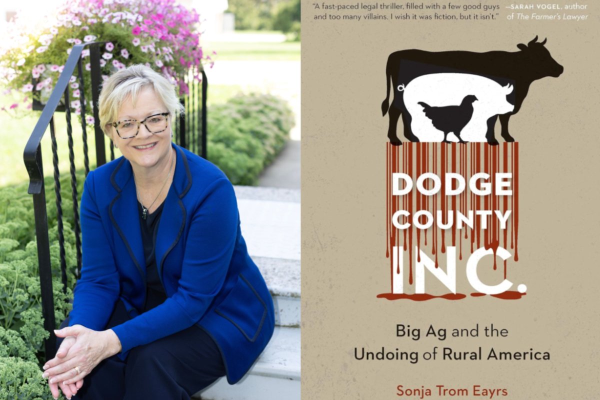 A woman wearing a blue shirt sits for a portrait and the image next to her is a book cover with a cow that says 